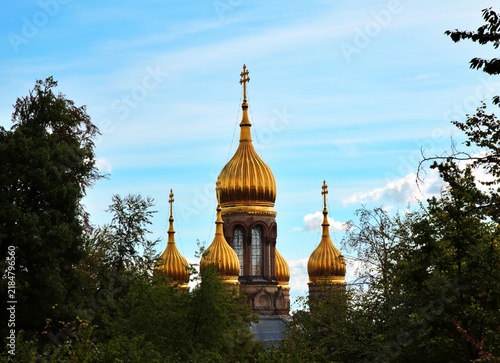 Photography Wiesbaden, Hesse, Germany – Golden onion domes of Russian Orthodox Church of Saint Elizabeth framed by lush green trees