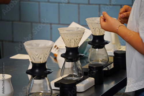 Fotografie Funnels with filters for brewing specialty coffee in a glass server