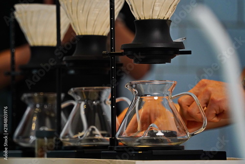 Fotografie Funnels with filters for brewing specialty coffee in a glass server