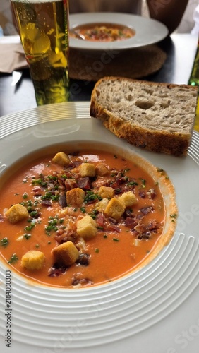 Traditional Spanish salmorejo tomato soup with croutons and ham