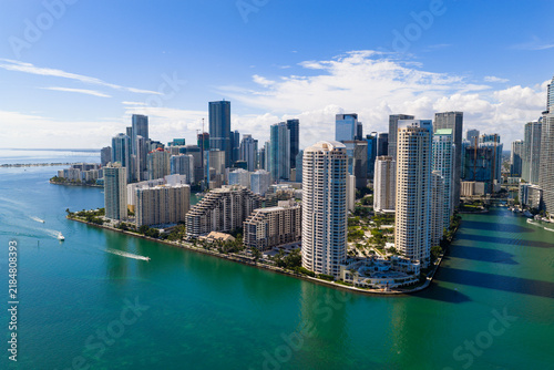 Miami Brickell skyline with skyscrapers along bay. Miami aerial cityscape with skyline. Miami coastal skyline with shoreline. Miami downtown skyline with towers.