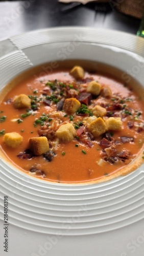 Traditional Spanish salmorejo tomato soup with croutons and ham