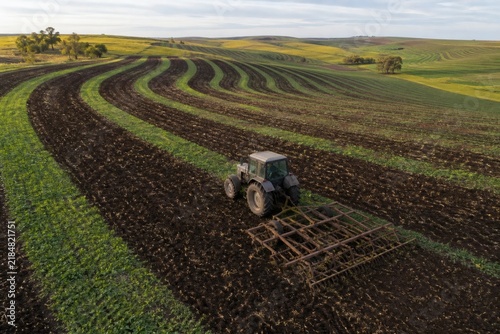 Tractor cultivating curved field rows