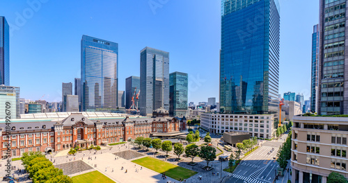 Tokyo cityscape with historic red brick station building and modern skyscrapers, Japan