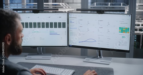 Data Center Engineer Responds to Detected DDoS Attack While Monitoring Network Infrastructure on Dual Displays, Supporting Cybersecurity, Threat Detection, Incident Response, and Service Continuity.