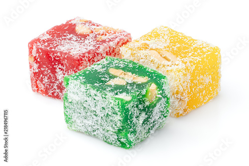 Assorted Turkish delight sweets pattern background. Colorful Rahat lokum with nuts and coconut flakes close up. Dessert	
