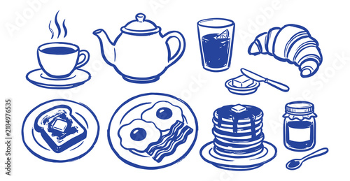 Breakfast set with coffee teapot pancakes eggs and croissant