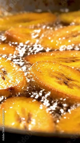Slices of Sweet Ripe Plantains Frying in Hot Bubbling Oil, a Traditional and Tasty African Food