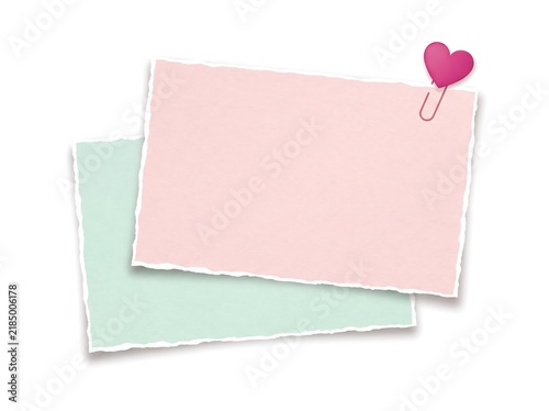 Two blank torn paper notes with pink heart paper clip for creative message design