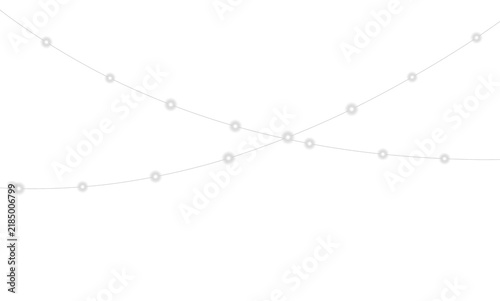 Принти на полотні Strings of spherical white lights hang against a solid black background