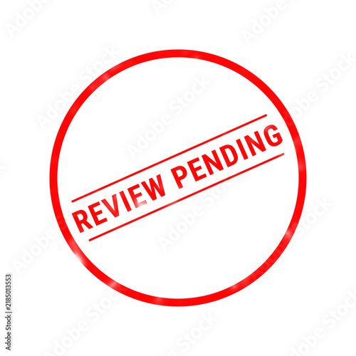 Fotografie A vibrant red rubber stamp illustration clearly indicates a review pending statu