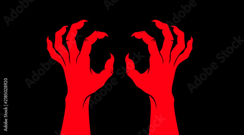 Фотография Red monster hands reaching out in a scary gesture