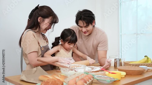 Family Cooking Together in a Kitchen While Making Dessert on a Weekend Morning