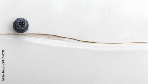 Blueberry on White Surface with Curved Scratch