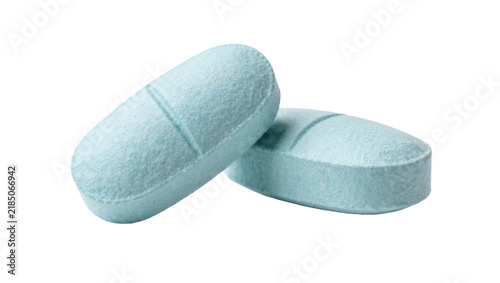 фотографія Two light blue oval pills with a score line, isolated on transparent background