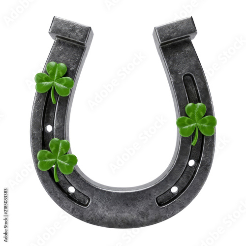 Metallic horseshoe with green clover leaves isolated on a transparent background