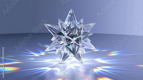 Faceted crystalline star rotates in a minimal studio with prismatic reflections. Holiday greeting design, winter campaign imagery, and luxury branding.