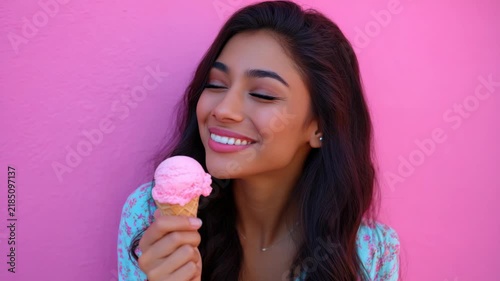 Smiling woman with ice cream lollipop