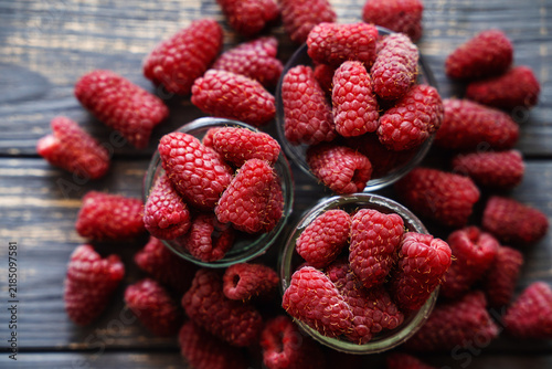 organic raspberries on wooden table background, food blogging, healthy eating concepts, and seasonal summer harvest themes. Small Farm food	