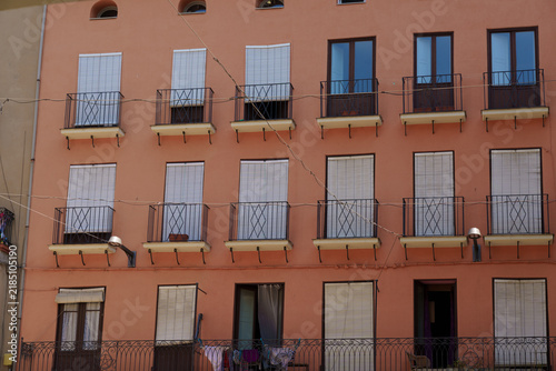 Foto Colorful Spanish urban architecture with balconies and street scenes