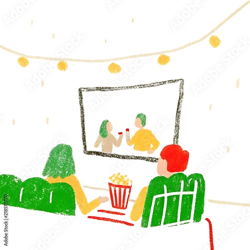 Two People Sitting On A Couch Watching A Movie With Popcorn And String Lights television