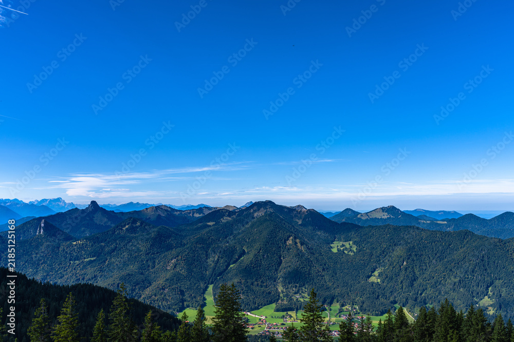 Fototapeta premium Stunning panorama view of peaks of Ammergebirge Alps from top of mountain Wallberg in summer on a sunny day, Miesbach, Bavaria, Germany