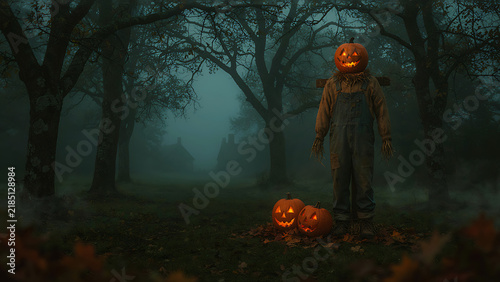 Pumpkin head scarecrow standing in dark foggy forest with glowing jack-o'-lanterns, created with generative ai.