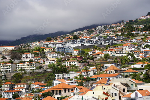 Canvas Print Scenic coastal village on a green hillside overlooking the Atlantic Ocean