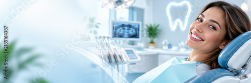 Happy woman smiling in a modern dental clinic, highlighting healthy teeth, professional oral care and cosmetic dentistry with clean bright space and copy space.