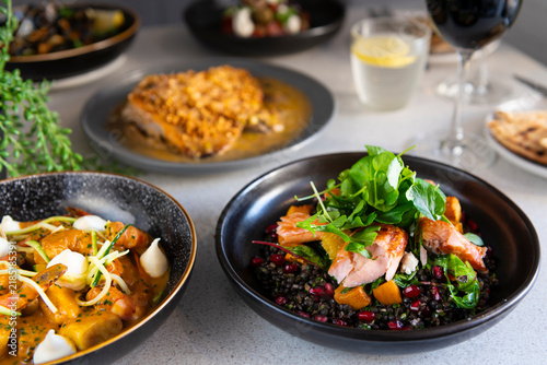 Delicious Culinary Creations Served on Elegant Plates in a Modern Setting