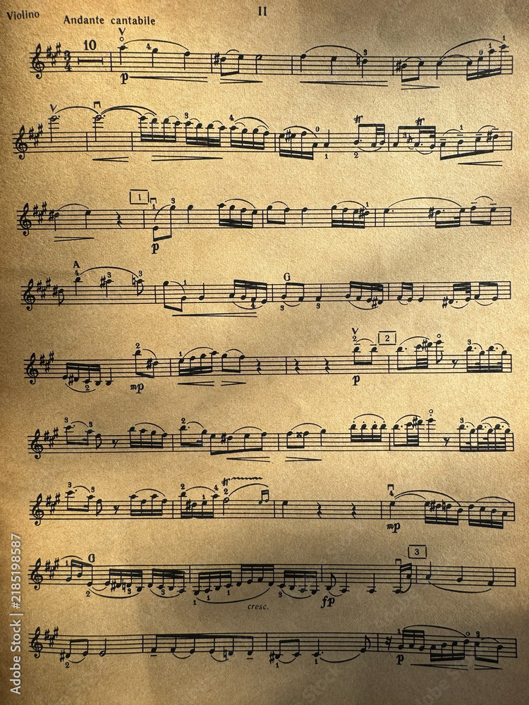 Fototapeta premium Close up of aged sheet music with musical notes and textured paper. Music notes Sheet on Aged Paper, black notes on brown paper, musical score, sheet music, musical notation, classical music 