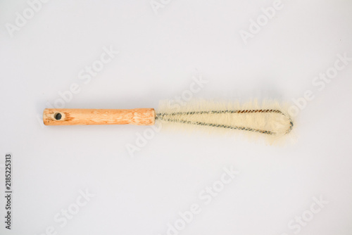 Bottle Cleaning Brush With Wooden Handle On A Plain Light Gray Background