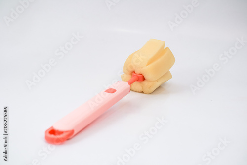 Pink Bottle Cleaning Brush With Beige Sponge Head On Isolated White Background