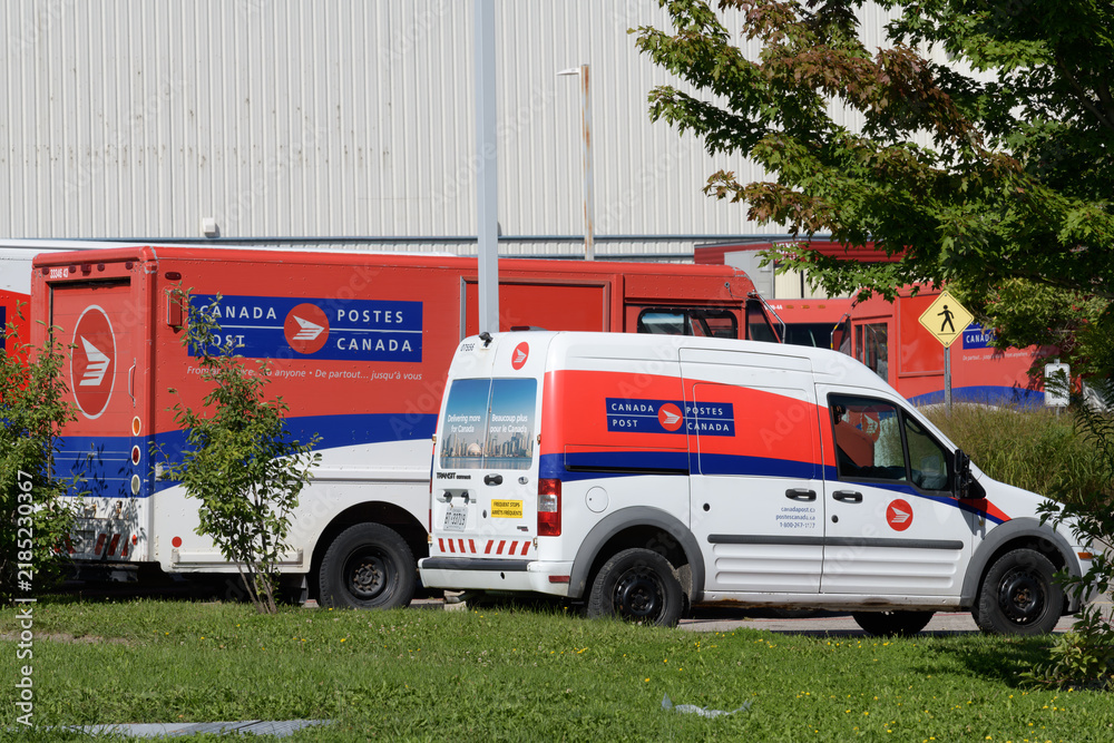 Fototapeta premium Canada Post vehicles at 70 Wynford Dr, Toronto