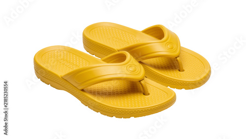 Photography Pair of bright yellow rubber flip-flops with textured soles, isolated on transpa