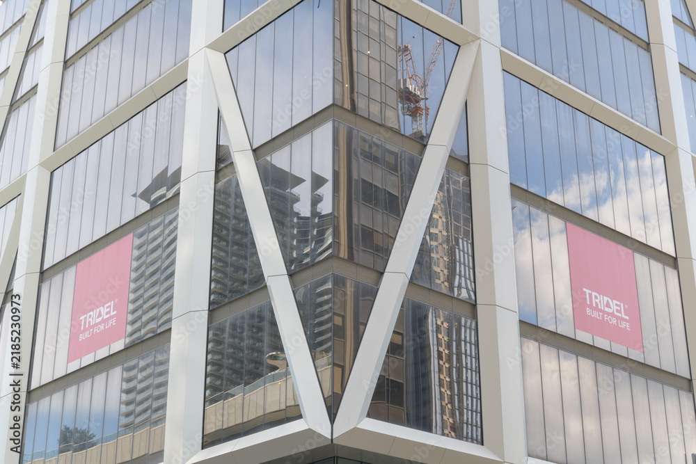 Fototapeta premium exterior of One Bloor West, a mixed-use residential and commercial tower, designed by London firm Foster + Partners, 1 Bloor St W, southwest corner of Yonge St, Toronto
