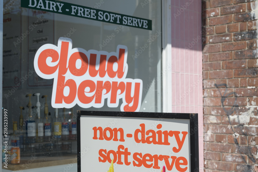 Fototapeta premium sidewalk a-frame poster sign and shop window of Cloudberry, an ice cream seller, located at 602 Danforth Av, Toronto