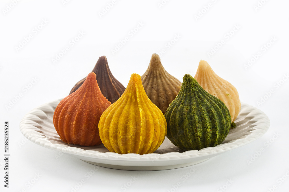 Obraz premium Colorful modak sweets on plate for ganesh chaturthi