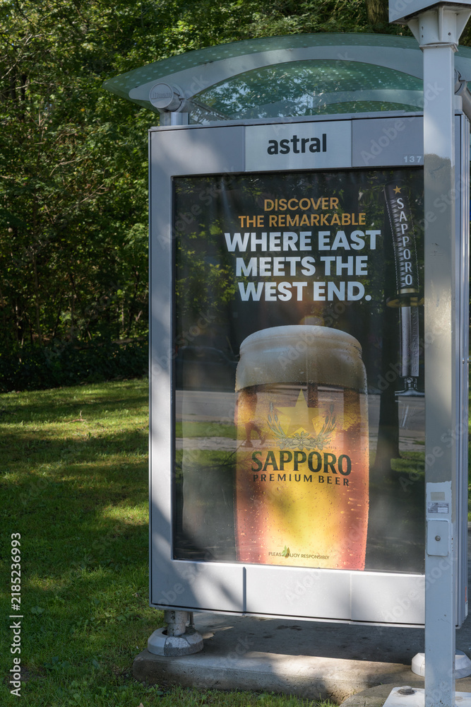 Fototapeta premium Sapporo beer poster at a transit shelter near High Park, Toronto