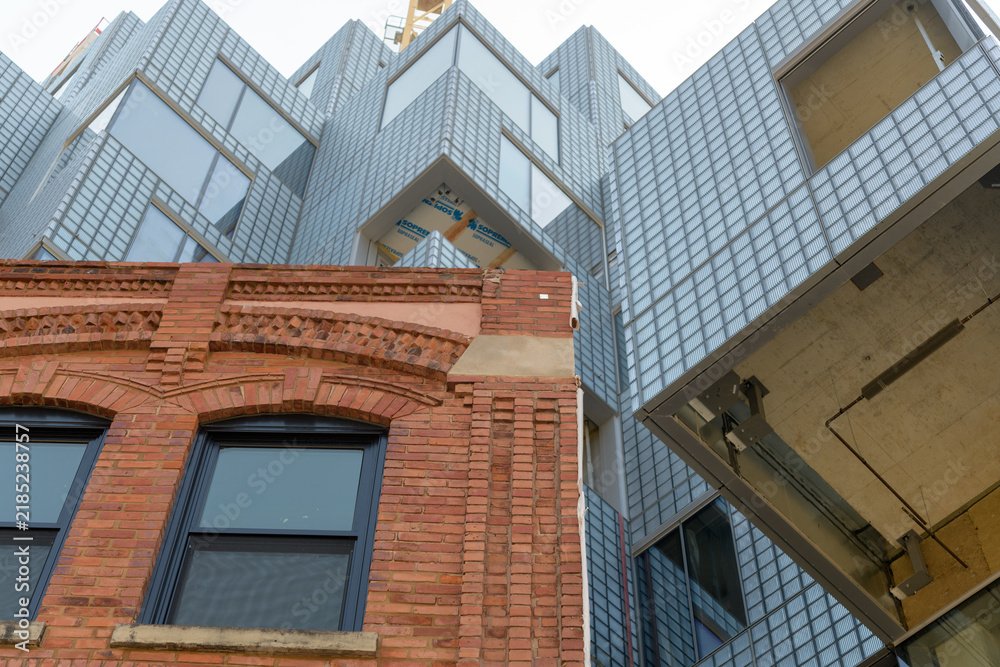 Obraz premium historic brick building and exterior of KING Toronto Condos designed by Bjarke Ingels Group (BIG) in the area of King W and Portland