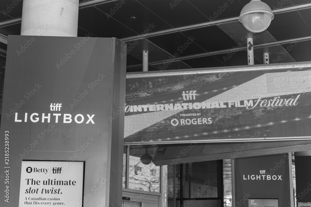 Obraz premium black and white exterior view of signage at TIFF Lightbox, a movie theatre, located at 350 King St W, Floor 1 of the Festival Tower, Toronto