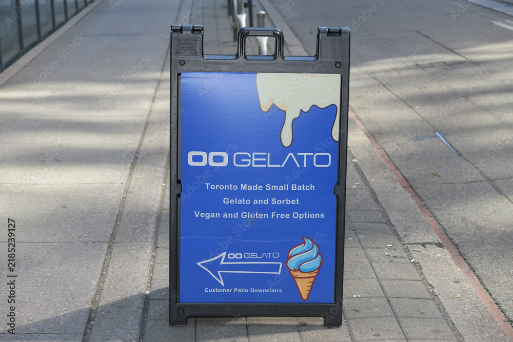 Obraz premium sidewalk a-frame sign outside Oogelato, an ice cream shop, located at 370 King St W, Floor 1 of the Hyatt Regency Toronto