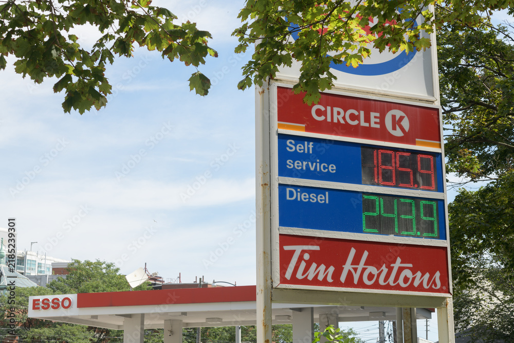 Fototapeta premium road side pylon featuring Circle K and Tim Hortons logos at Esso, a gas station, located at 553 Lake Shore Blvd W, Toronto