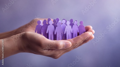 hands holding purple paper people representing diversity, inclusion, teamwork and psychological safety, human resources, employee wellbeing, corporate training