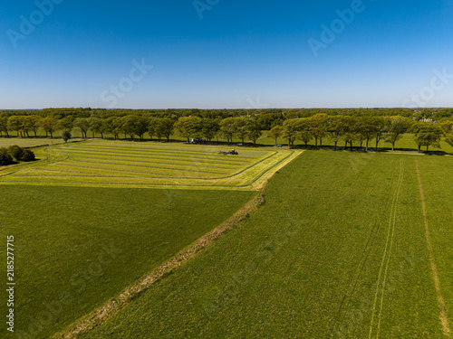 Konstfotografi High angle wide horizontal aerial drone photograph of agricultural tractor rakin