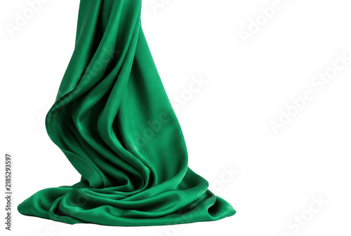 Cascading Green Silk Fabric Flowing Against a Solid Black Background