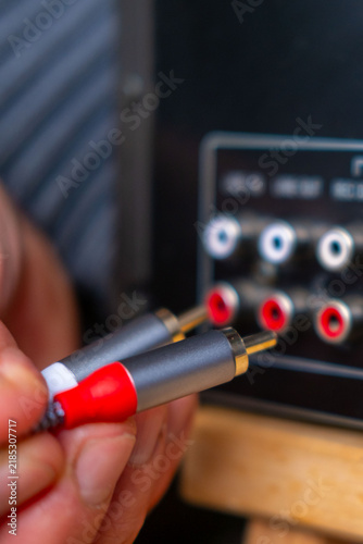 Foto Black phono preamplifier with RCA connectors, ground terminal, power input jack,