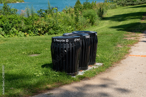 фотографія Recycling and waste bins in a public park, providing separate containers for rec