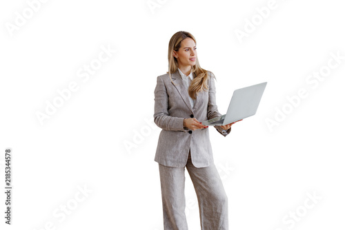 Businesswoman standing and holding laptop, looking away with thoughtful expression, working with technology, transparent background