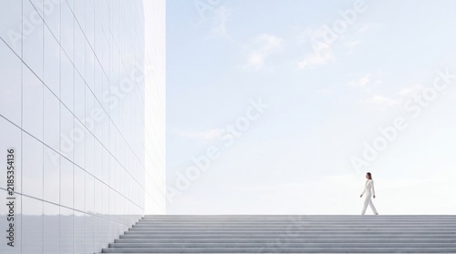 Businesswoman Walking near Modern White Architectural Building